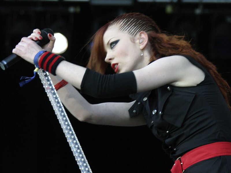 woman singing on stage
