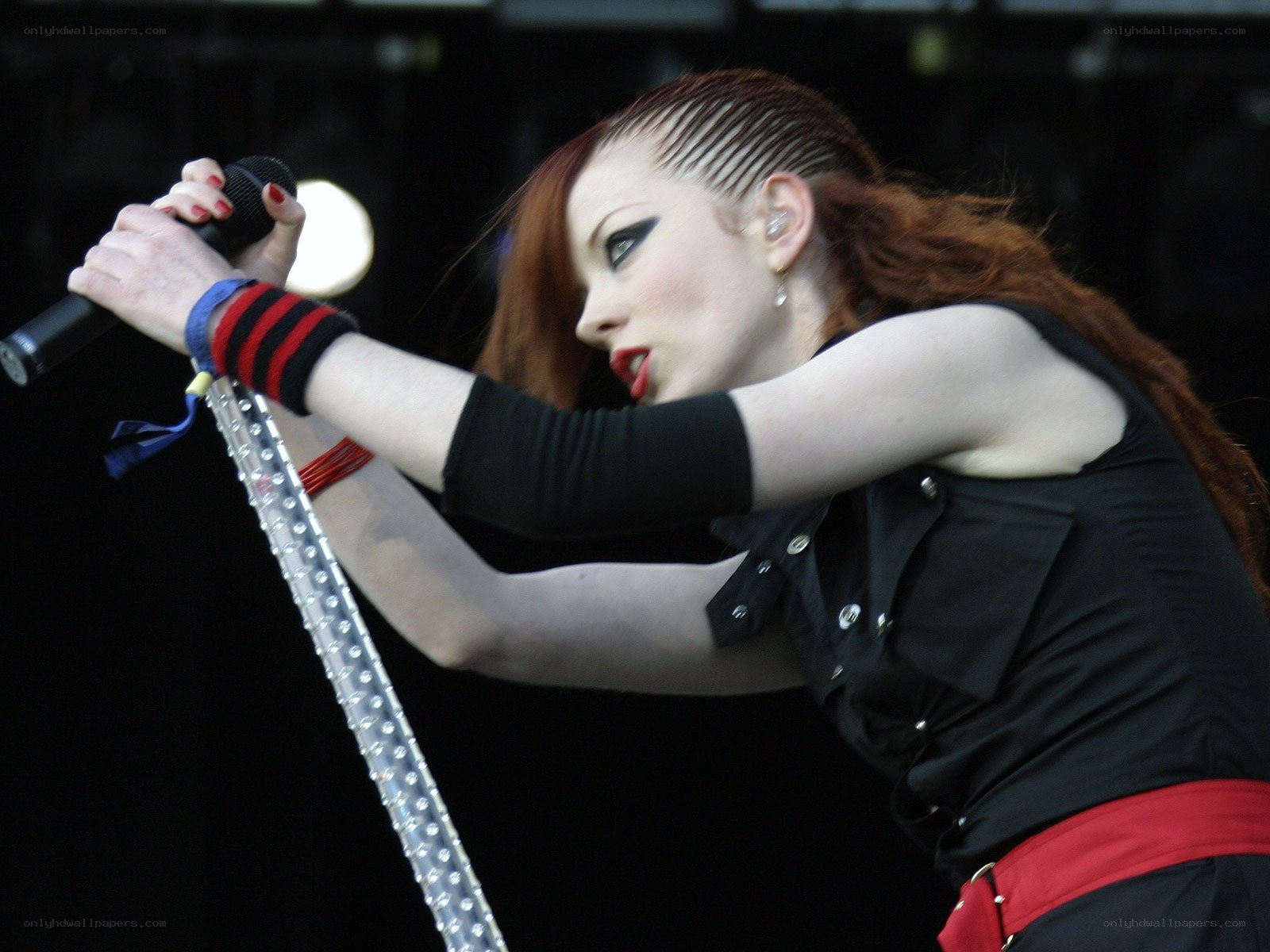woman singing on stage