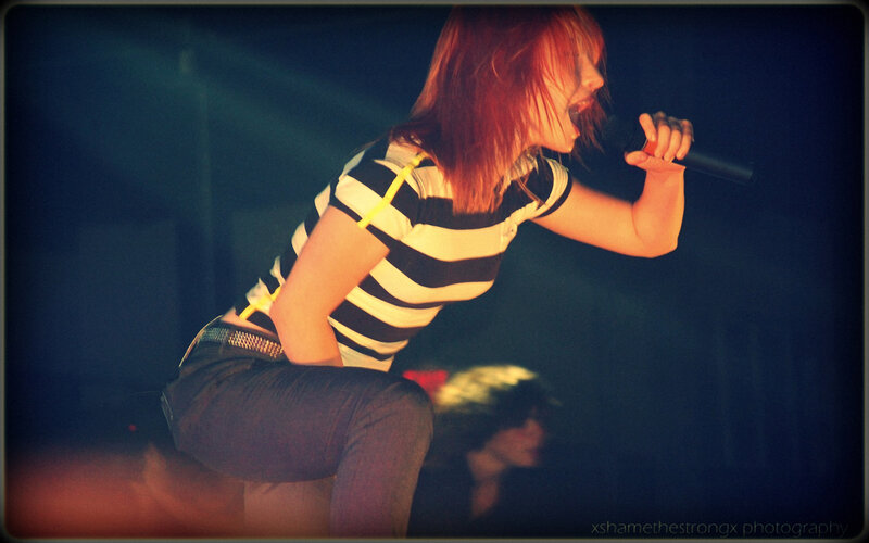 woman singing on stage
