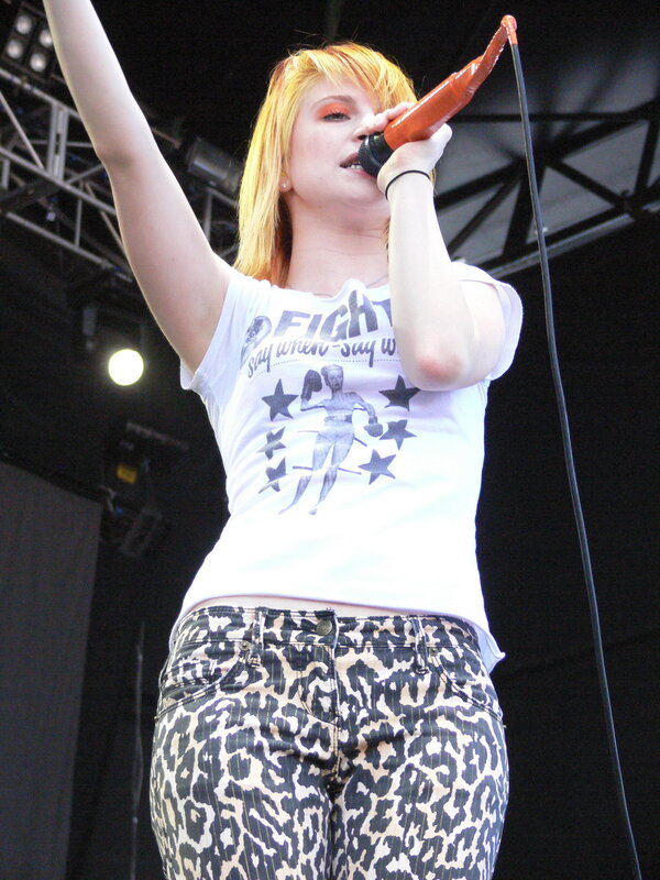 woman singing on stage