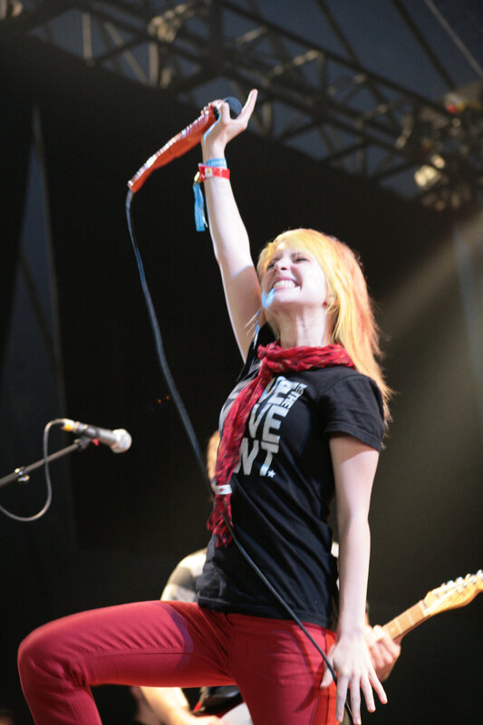 woman singing on stage