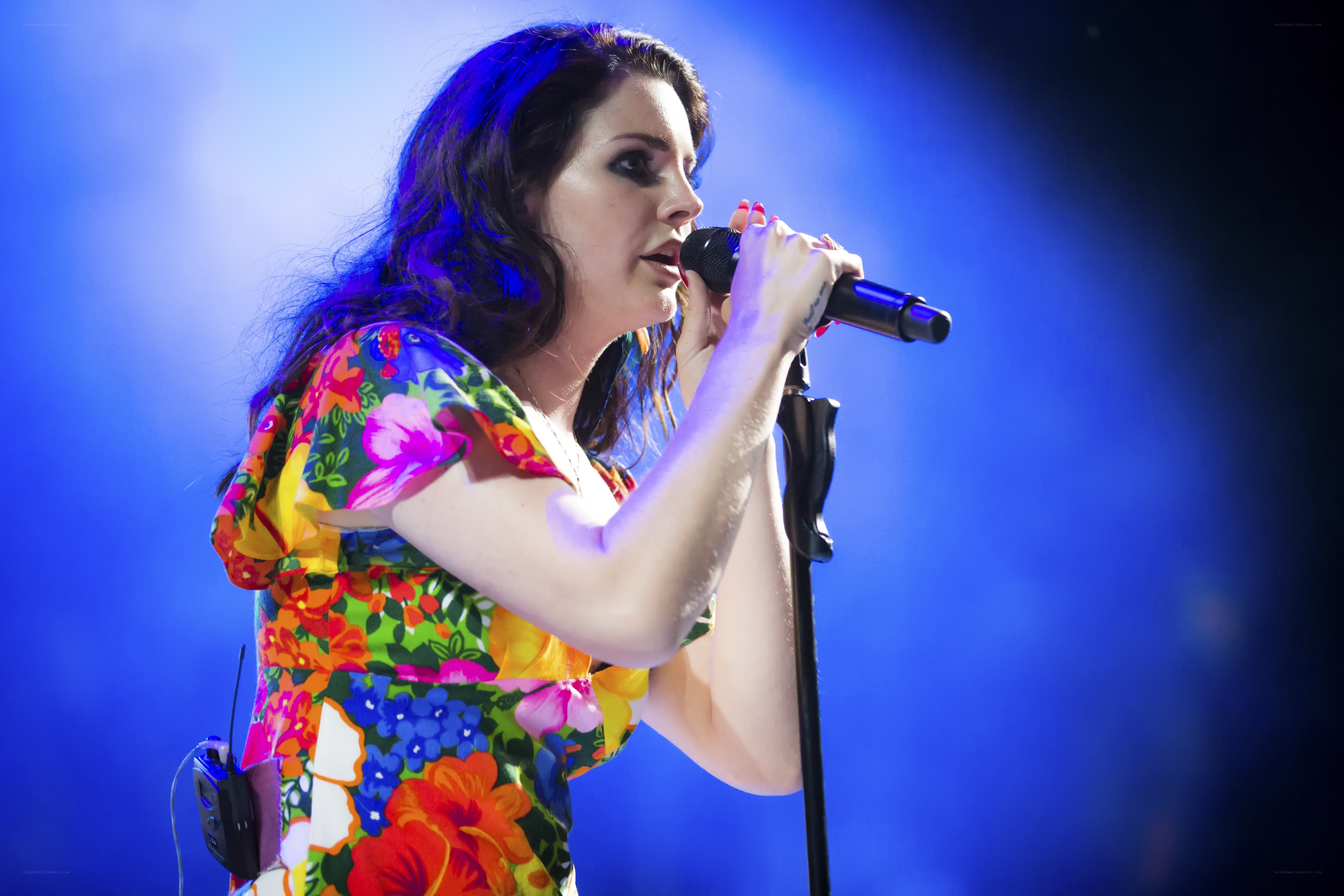 woman singing on stage