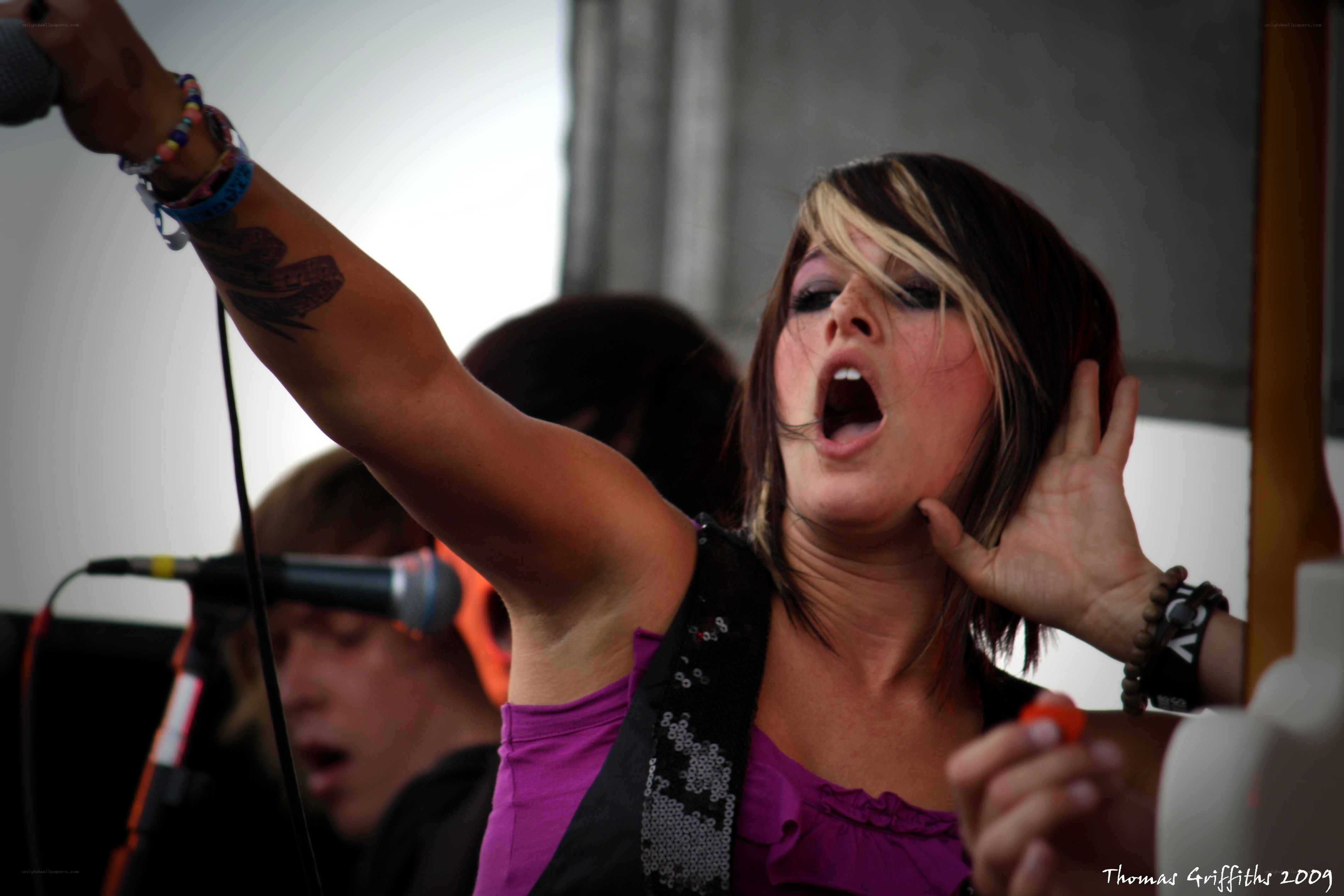 Woman singing on stage
