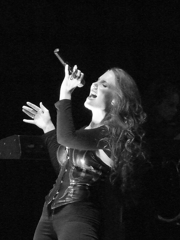 woman singing on stage
