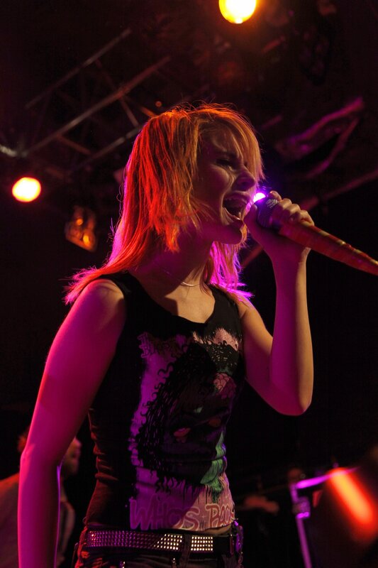 woman singing on stage
