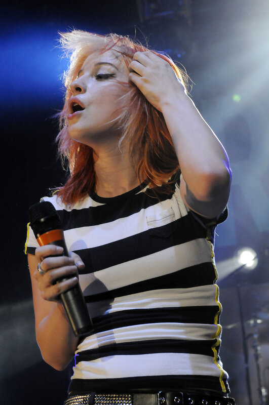 woman singing on stage