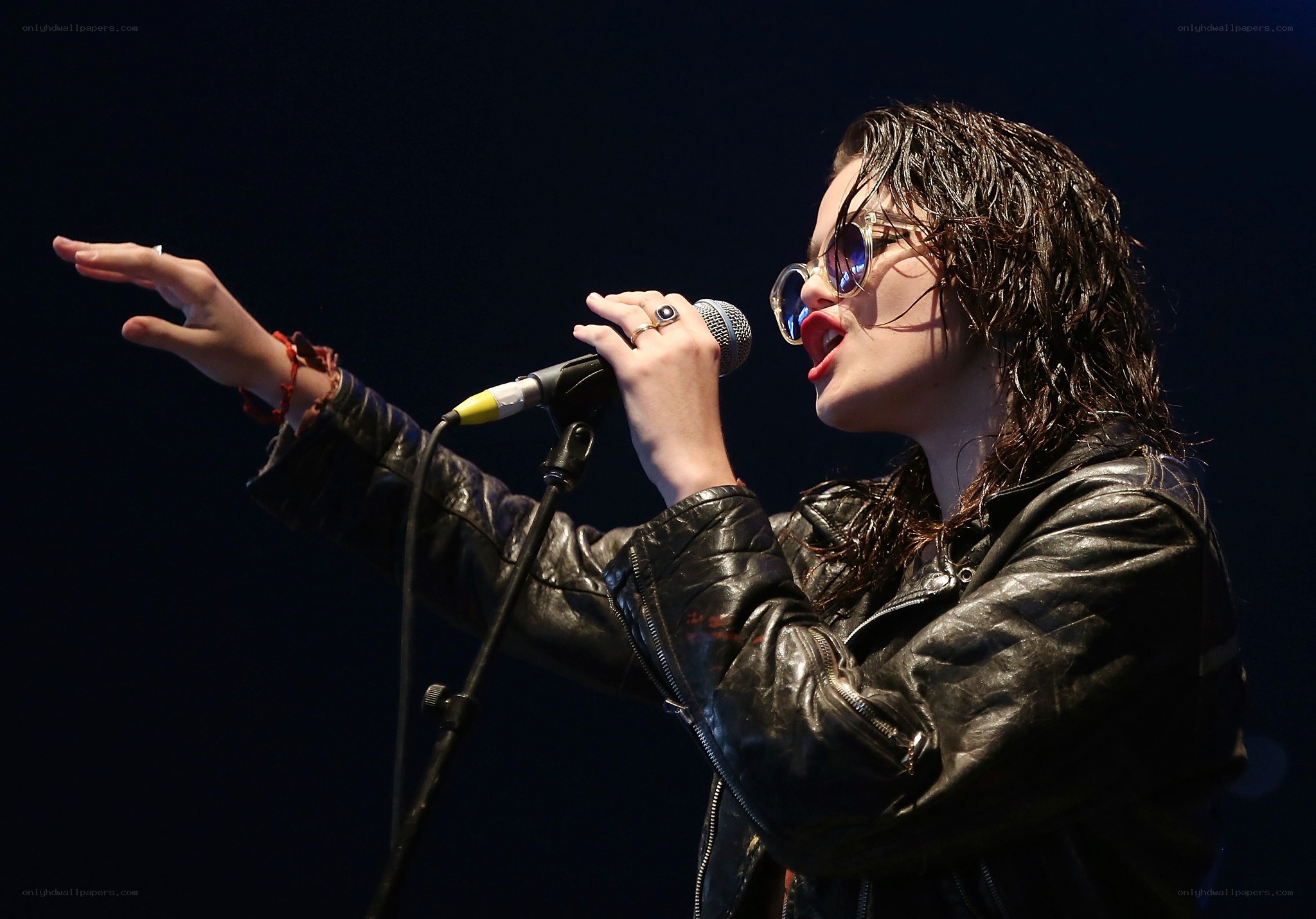 woman singing on stage