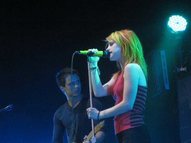 woman singing on stage