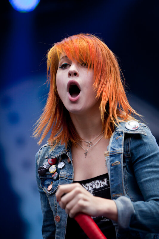 woman singing on stage