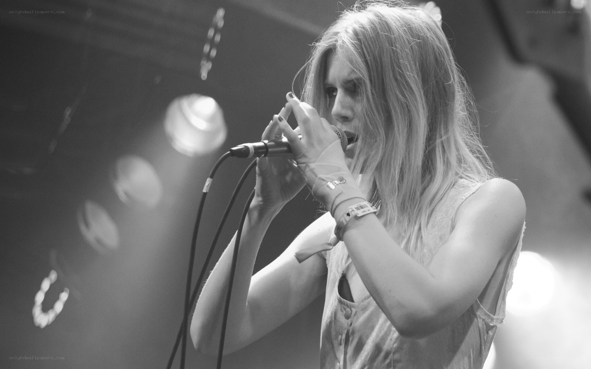 woman singing on stage