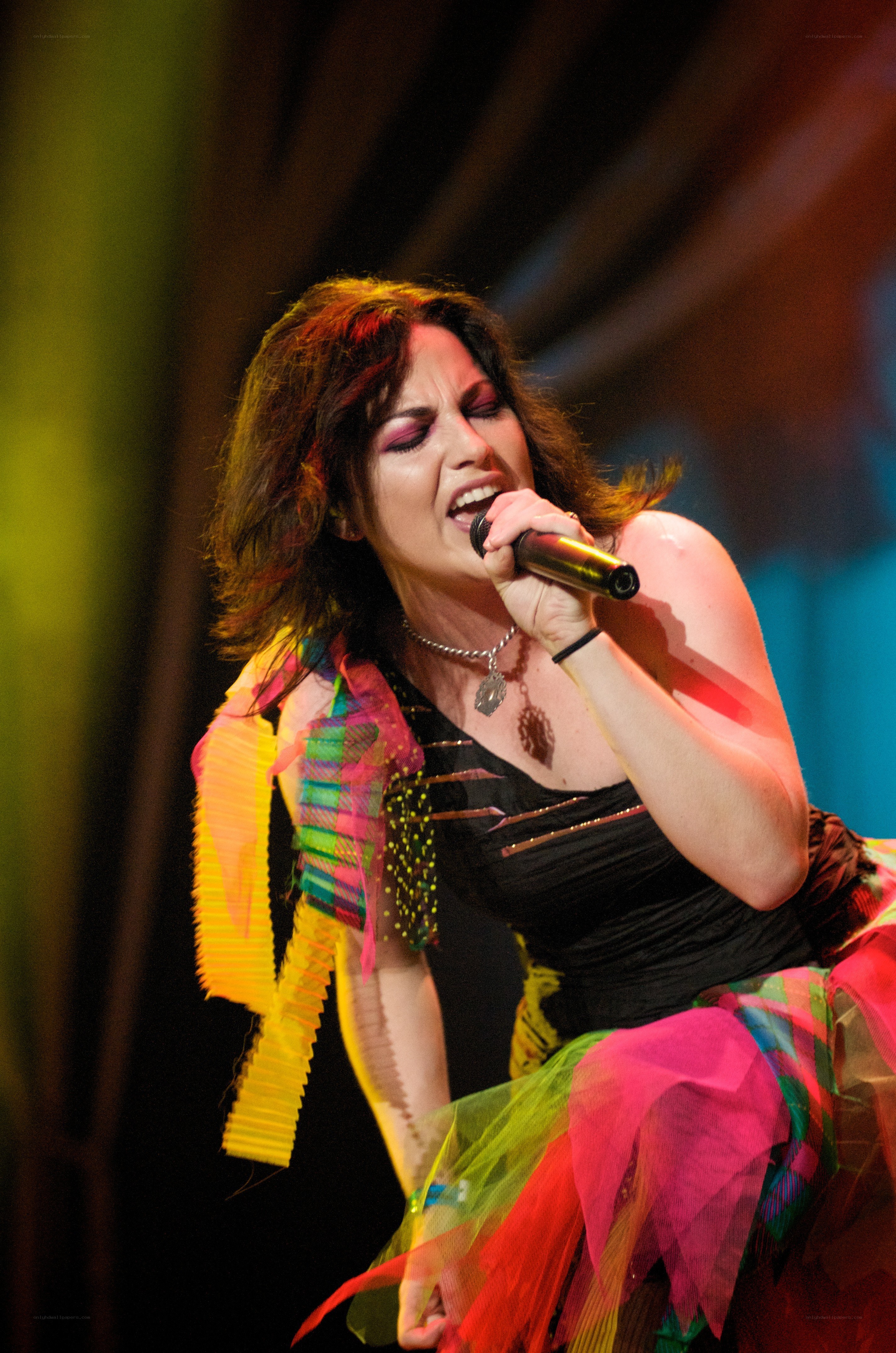 woman singing on stage