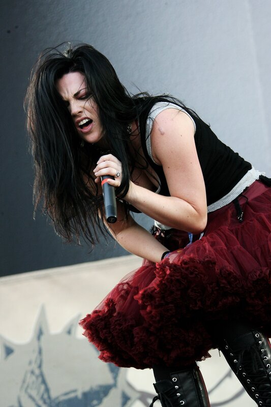 woman singing on stage