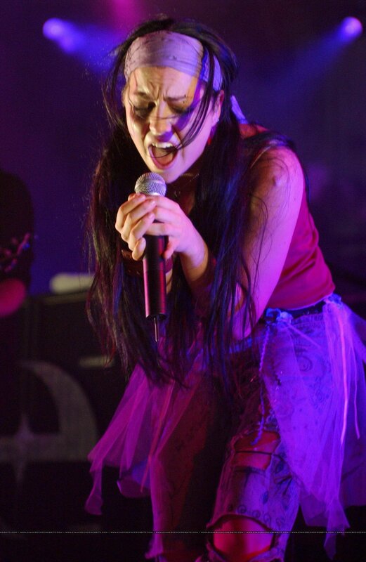 woman singing on stage