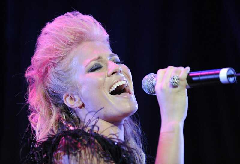 woman singing on stage