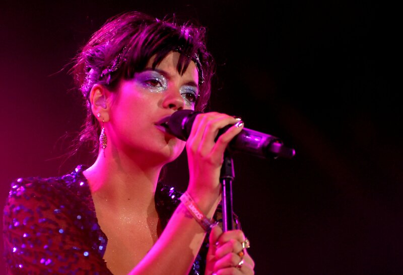 woman singing on stage