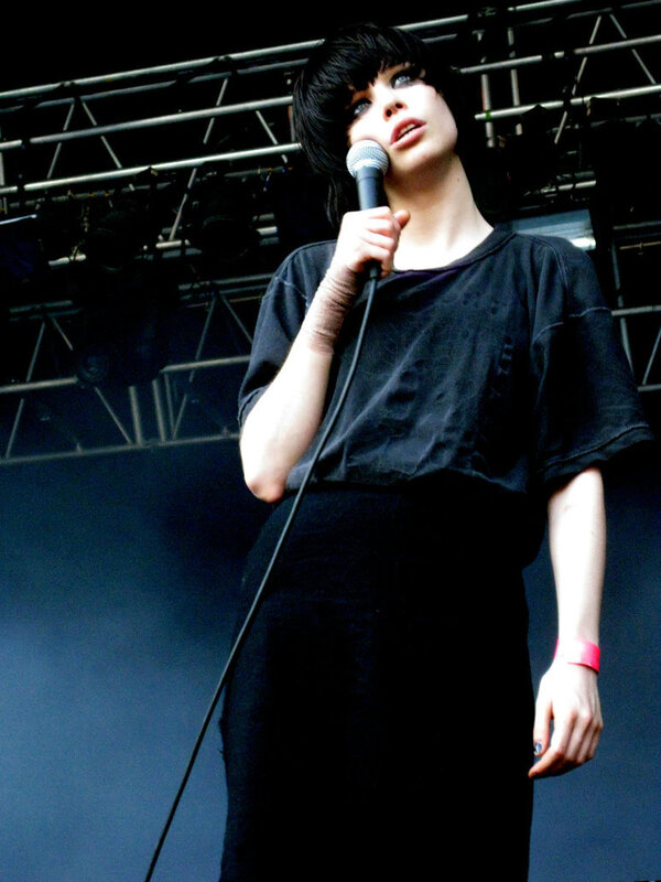 woman singing on stage