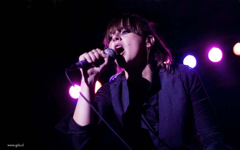 woman singing on stage
