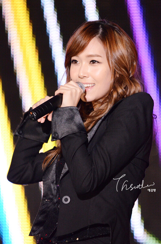 woman singing on stage