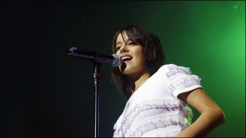 woman singing on stage