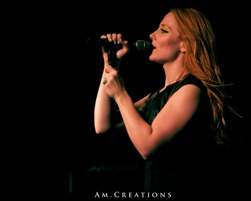 woman singing on stage