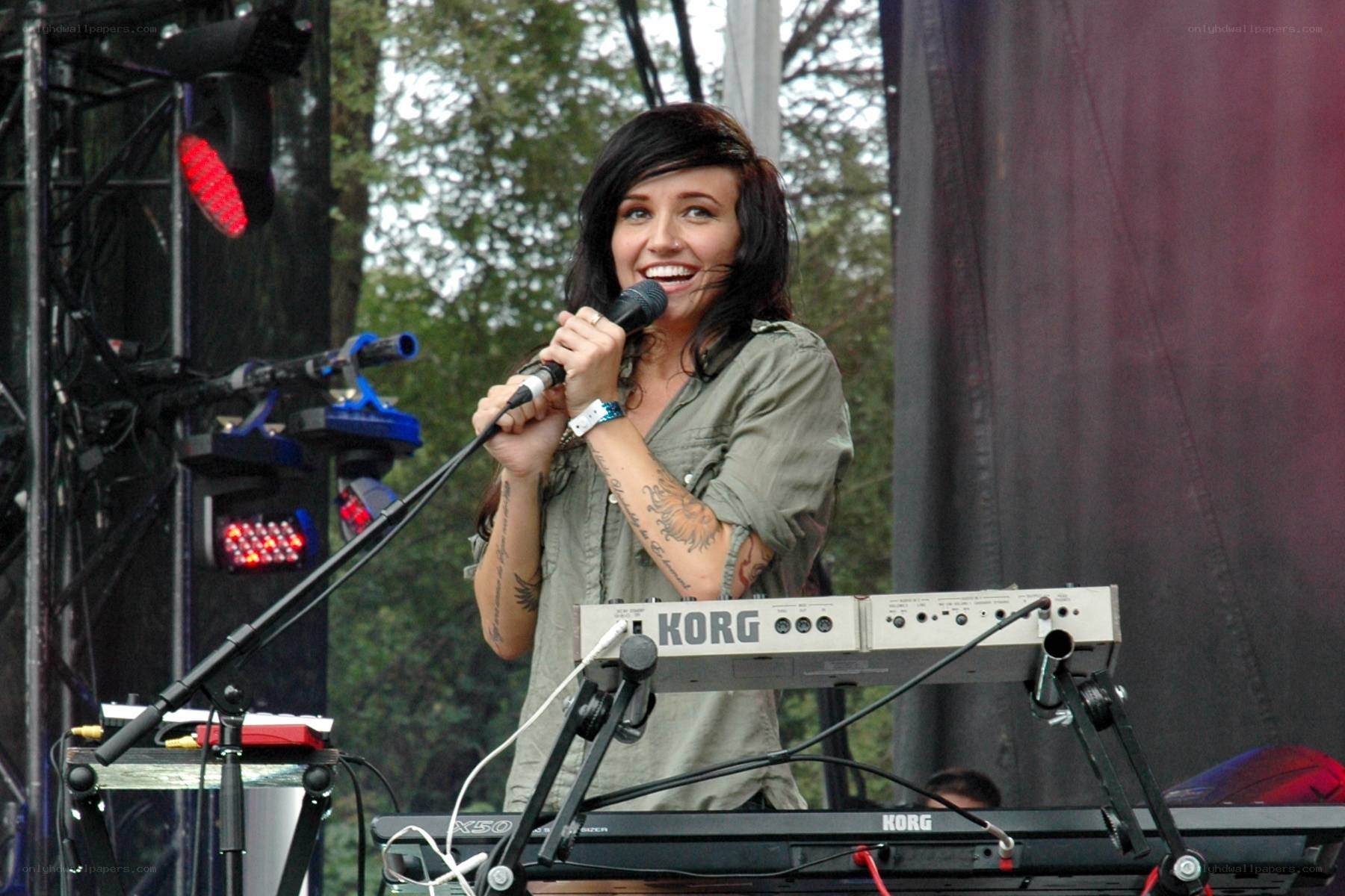 woman singing on stage