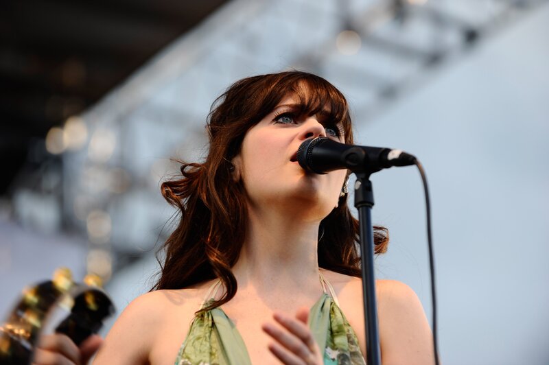 woman singing on stage