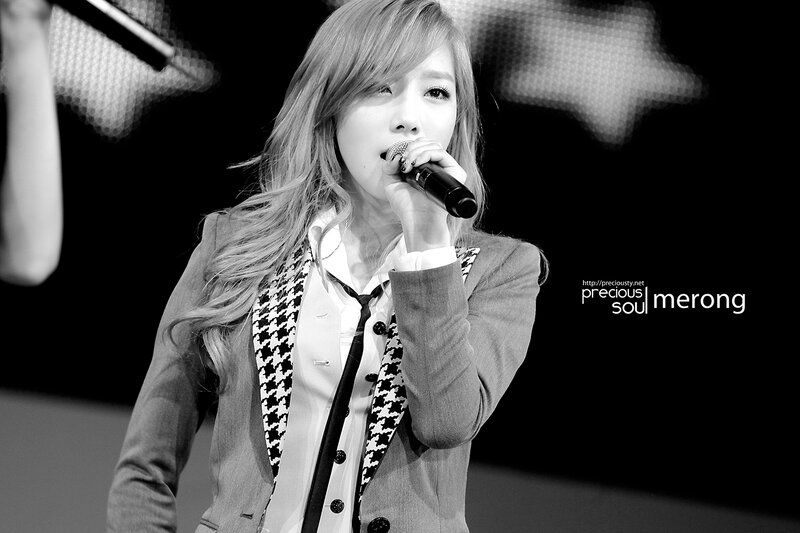 woman singing on stage