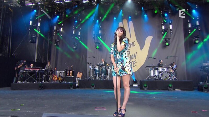 woman singing on stage