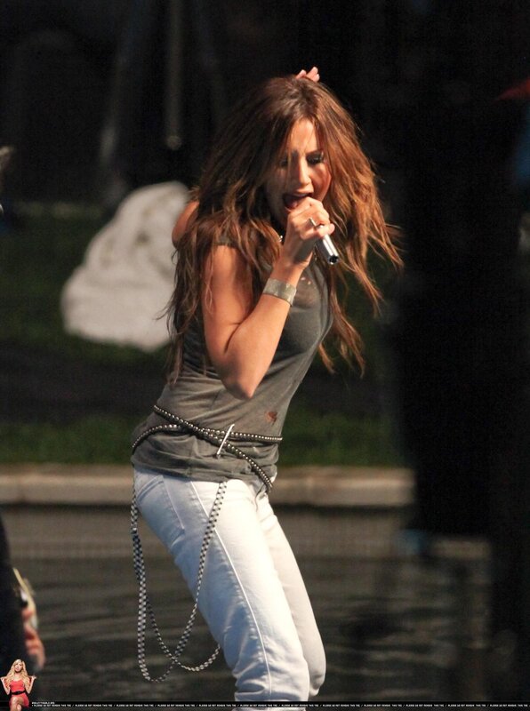 woman singing on stage