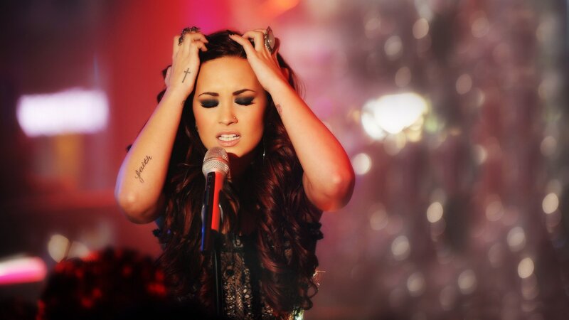 woman singing on stage