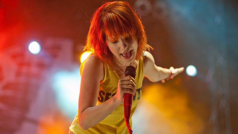 woman singing on stage