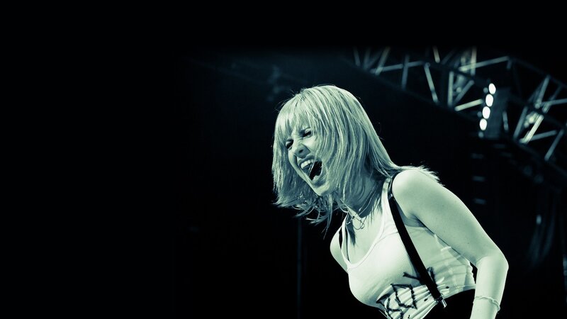 woman singing on stage