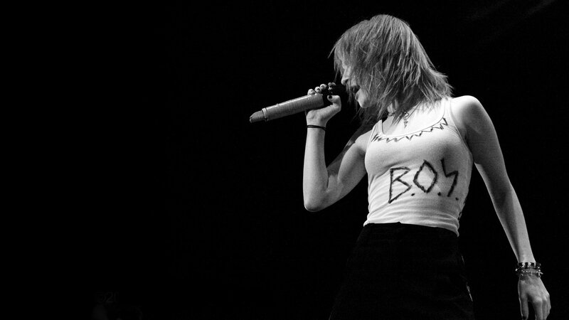 woman singing on stage