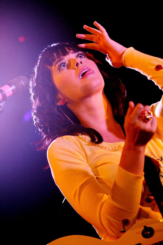 woman singing on stage