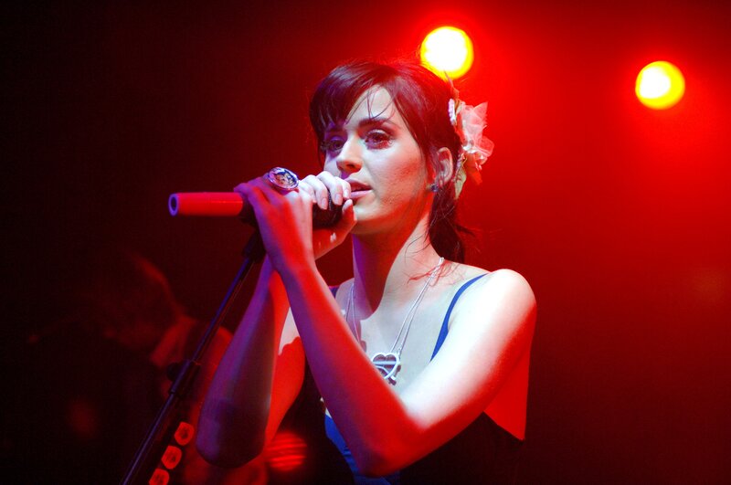 woman singing on stage