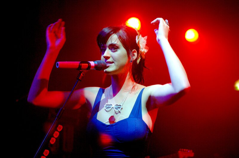 woman singing on stage