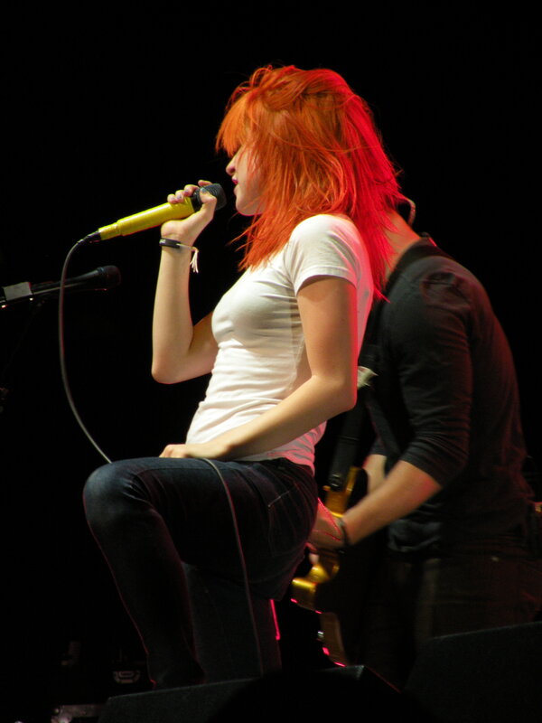 woman singing on stage