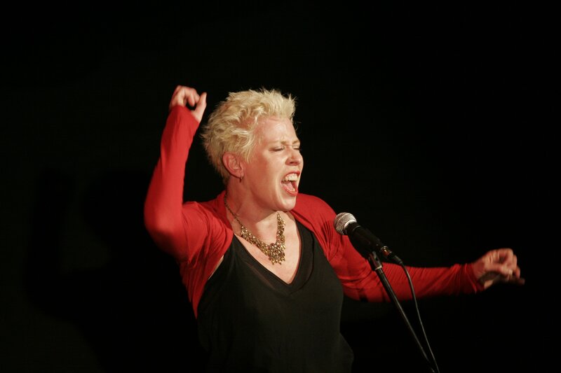 Woman singing on stage