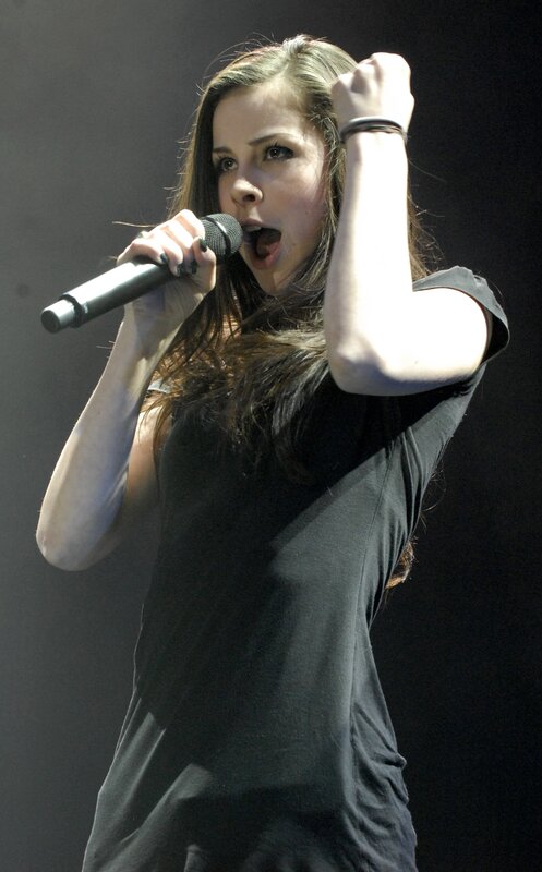 woman singing on stage