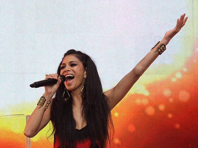 woman singing on stage