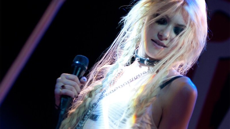 woman singing on stage
