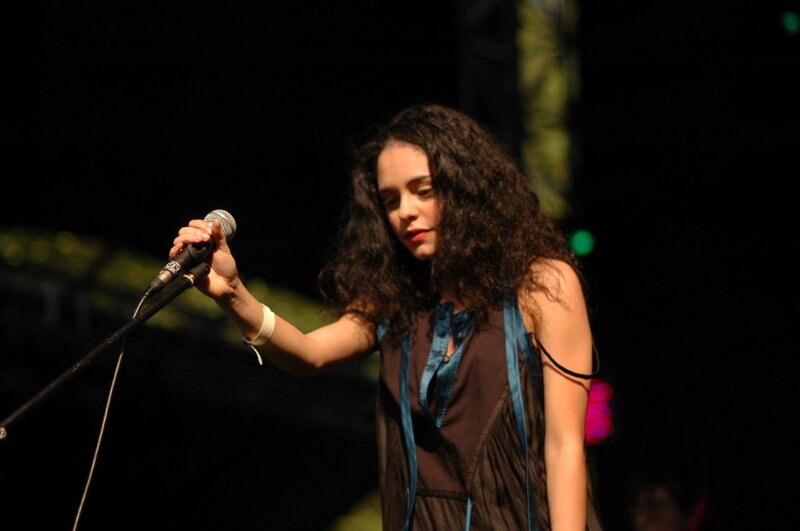 woman singing on stage
