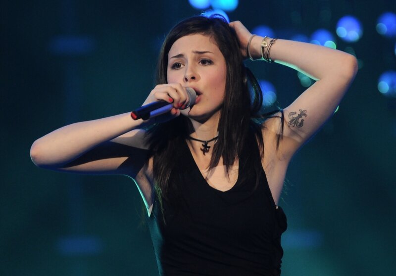 woman singing on stage