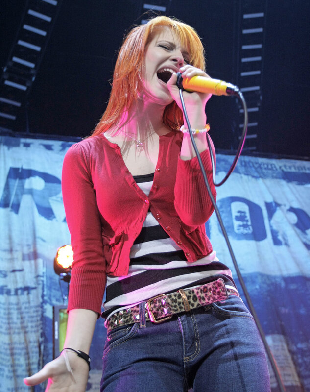 woman singing on stage