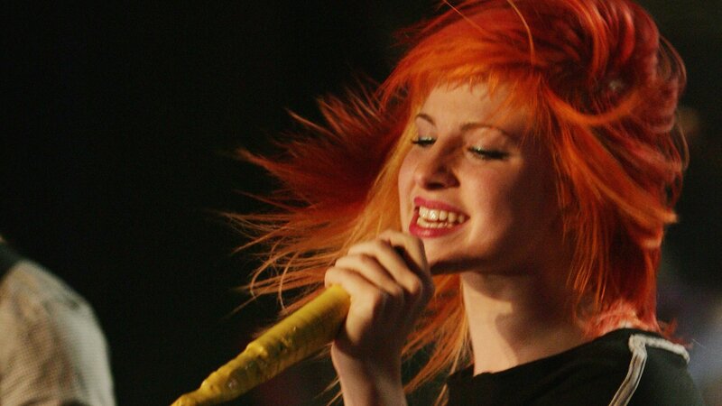 woman singing on stage