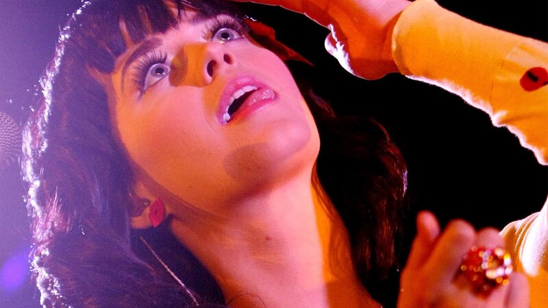 woman singing on stage