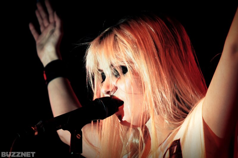 woman singing on stage