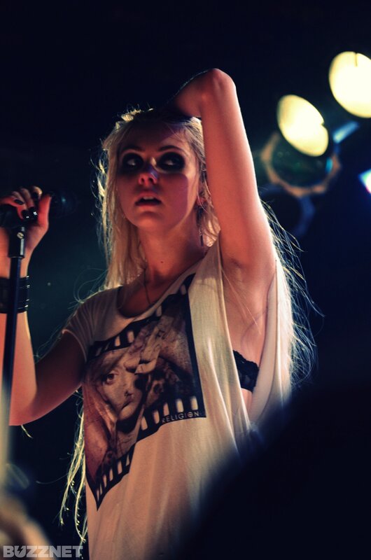 woman singing on stage