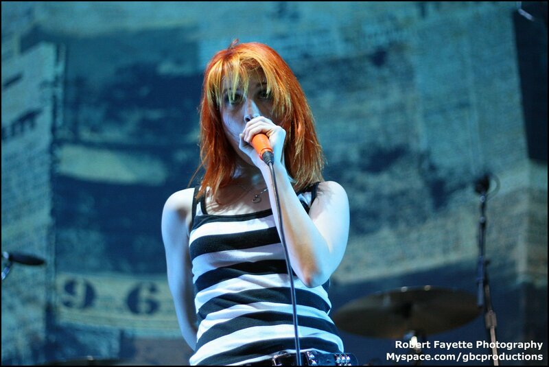 woman singing on stage