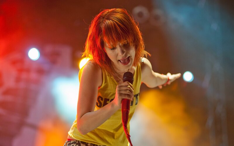 woman singing on stage